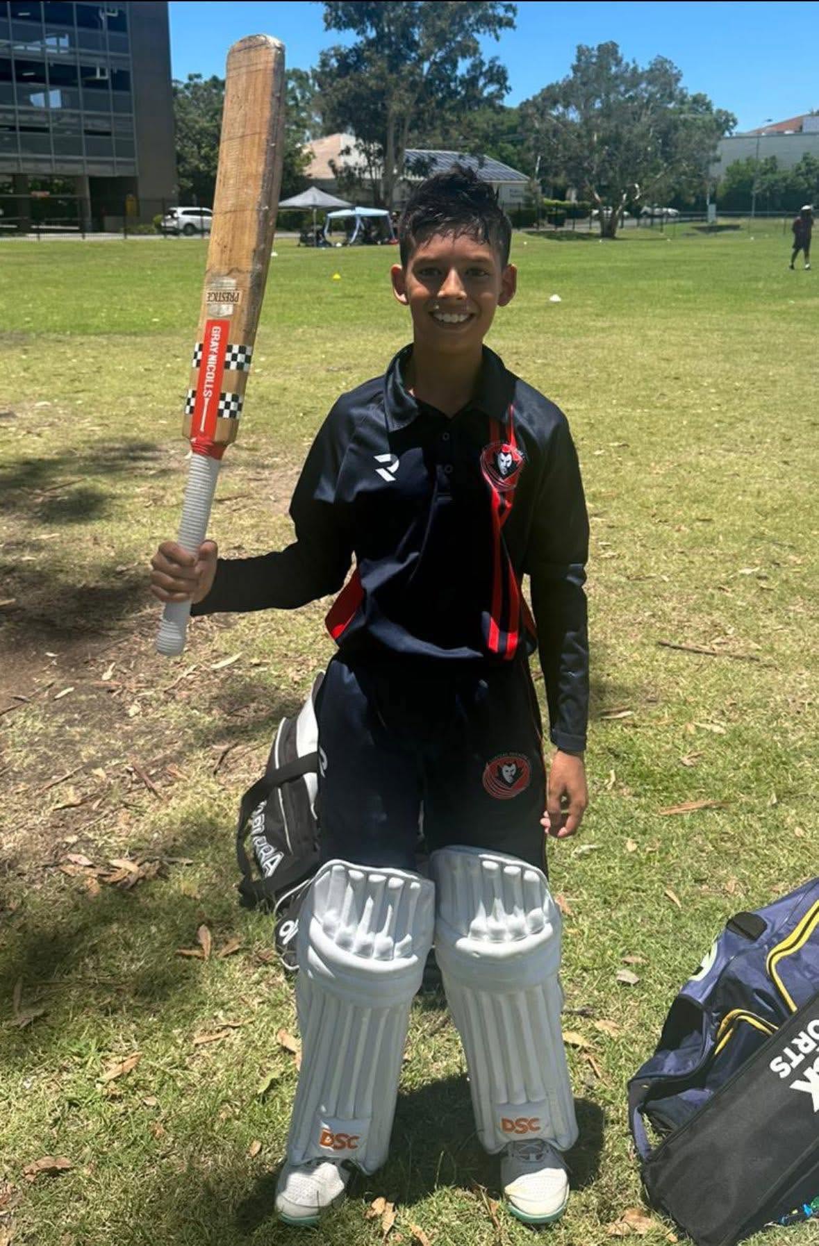 Young batter holding his bat